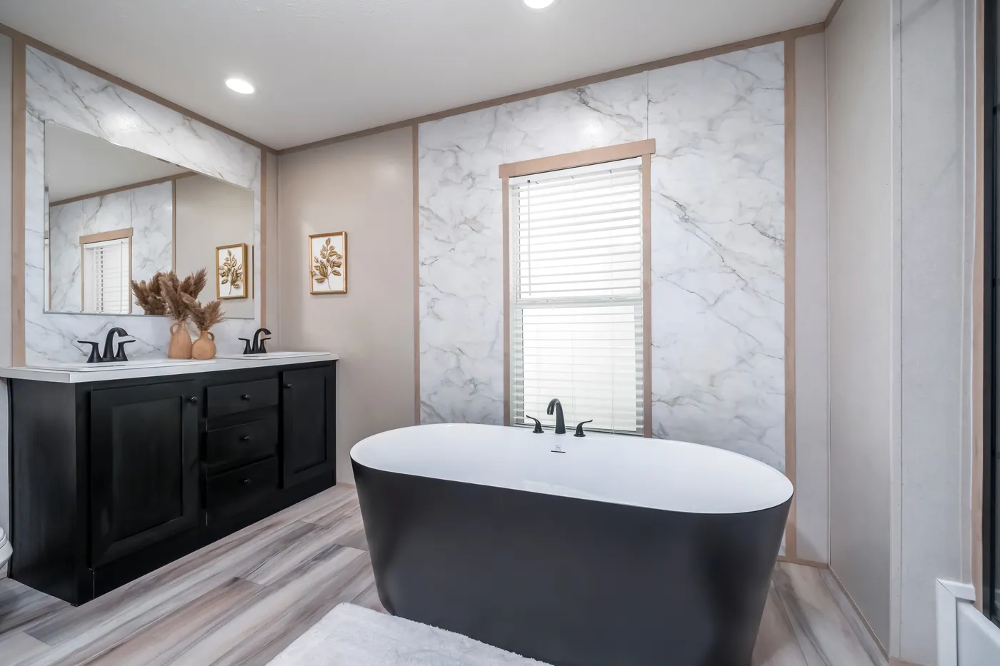 The ANNIVERSARY JEWEL Primary Bathroom. This Manufactured Mobile Home features 3 bedrooms and 2 baths.