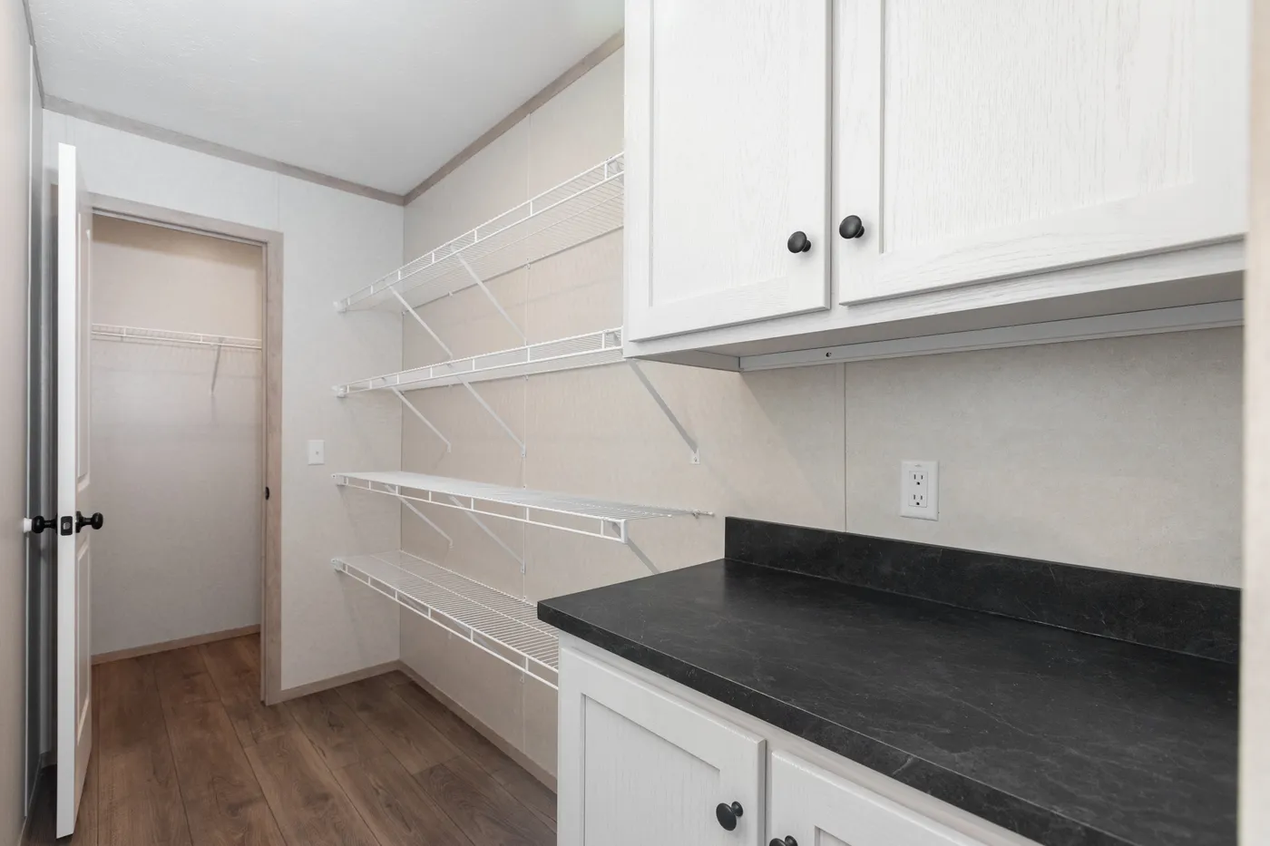 The 6032-5700 THE PULSE Storage. This Manufactured Mobile Home features 3 bedrooms and 2 baths.