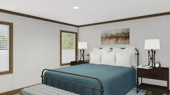 The HOMESTEAD BREEZE Primary Bedroom. This Manufactured Mobile Home features 4 bedrooms and 2 baths.