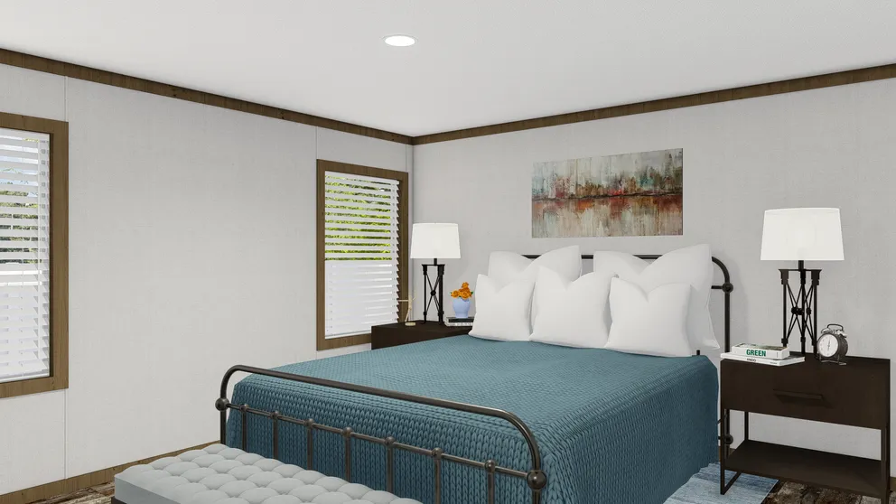 The HOMESTEAD BREEZE Primary Bedroom. This Manufactured Mobile Home features 4 bedrooms and 2 baths.