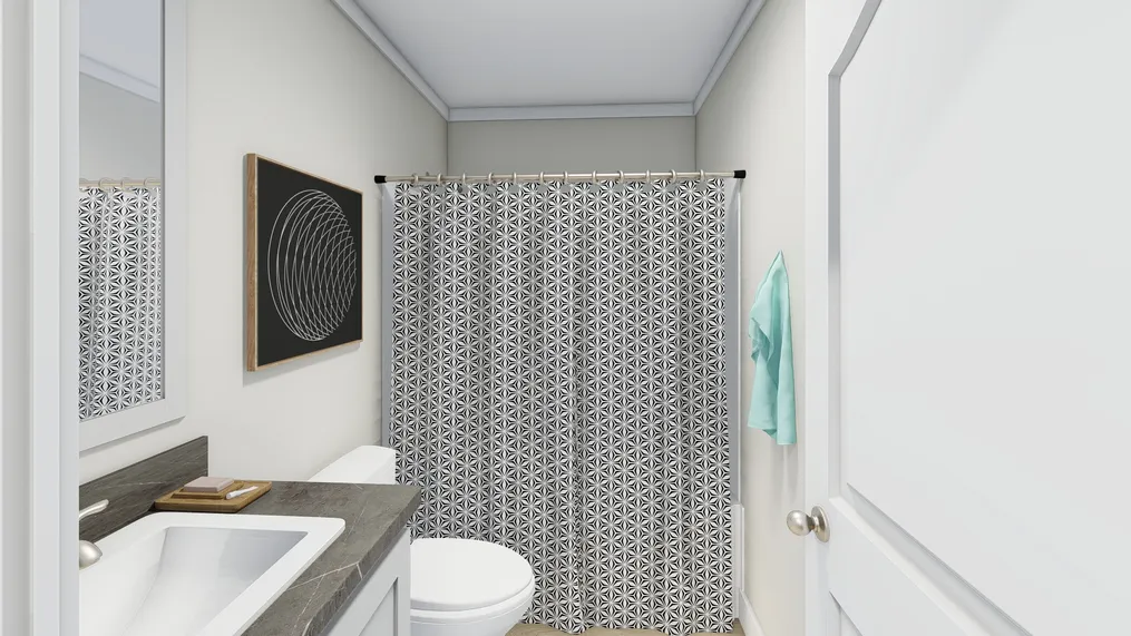 The CLASSIC 56D Guest Bathroom. This Manufactured Mobile Home features 3 bedrooms and 2 baths.