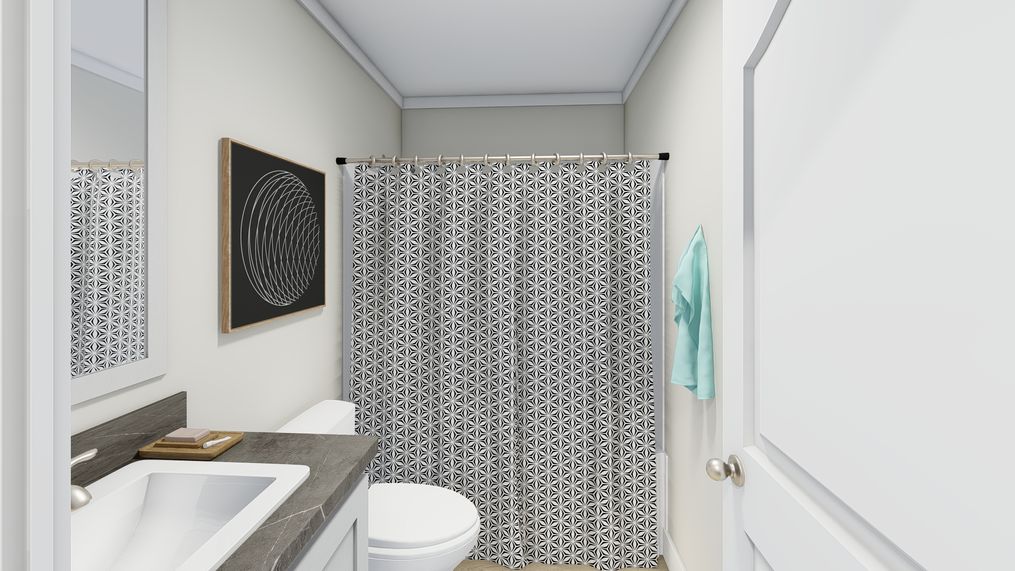 The CLASSIC 56D Guest Bathroom. This Manufactured Mobile Home features 3 bedrooms and 2 baths.