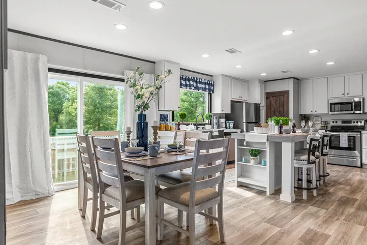 The THE ANNIVERSARY 2.1 Dining Area. This Manufactured Mobile Home features 3 bedrooms and 2 baths.
