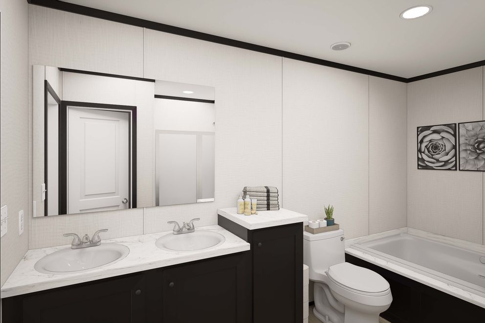 The PLATINUM ANNIVERSARY Primary Bathroom. This Manufactured Mobile Home features 3 bedrooms and 2 baths.