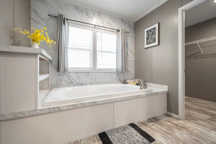 The CASCADE Primary Bathroom. This Manufactured Mobile Home features 4 bedrooms and 2 baths.