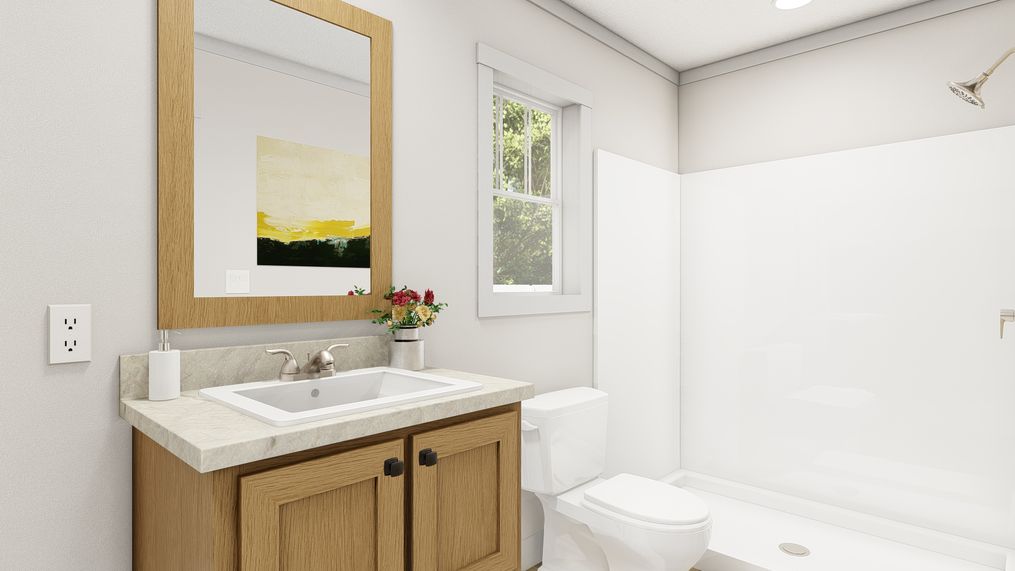 The WALK THE LINE Primary Bathroom. This Manufactured Mobile Home features 3 bedrooms and 2 baths.