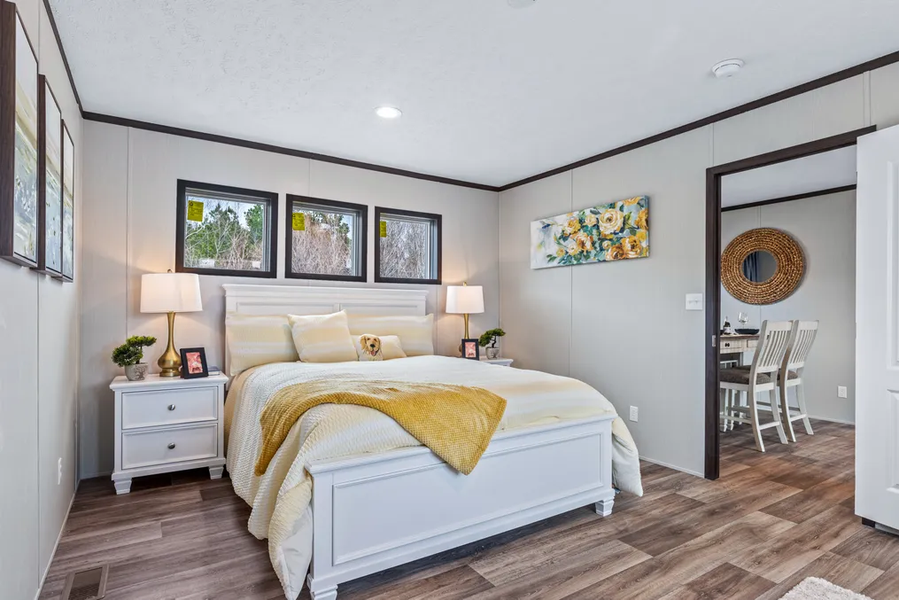 The THE GRAND Primary Bedroom. This Manufactured Mobile Home features 3 bedrooms and 2 baths.