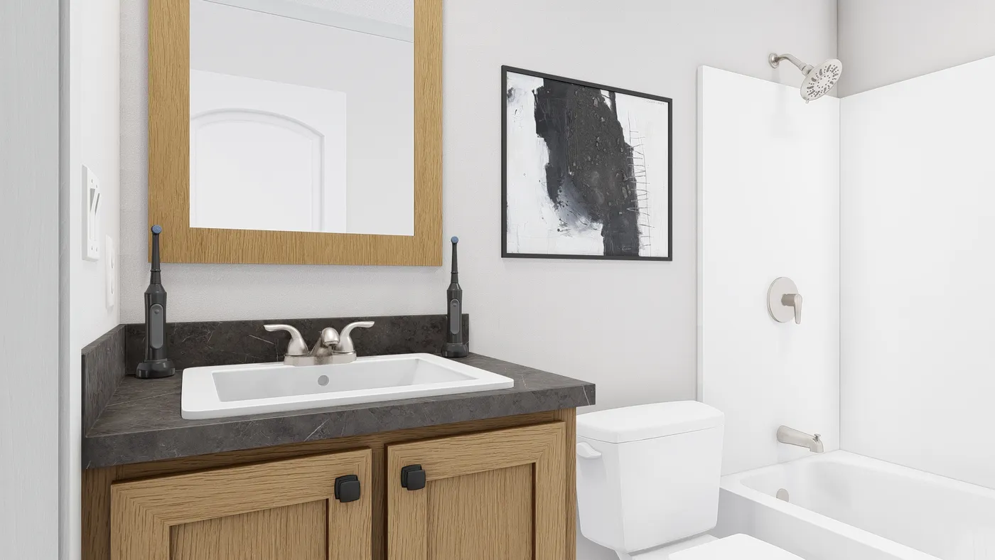 The JOHNNY B GOODE Guest Bathroom. This Manufactured Mobile Home features 3 bedrooms and 2 baths.