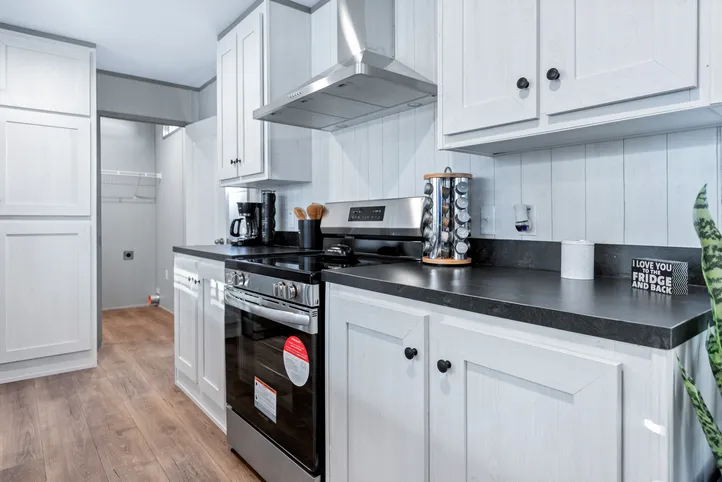 The RESOLUTION 16763X Kitchen. This Manufactured Mobile Home features 3 bedrooms and 2 baths.
