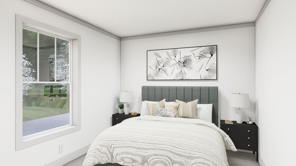 The WONDERFUL WORLD Guest Bedroom. This Manufactured Mobile Home features 3 bedrooms and 2 baths.