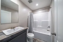 The ANNIVERSARY CHOICE Guest Bathroom. This Manufactured Mobile Home features 3 bedrooms and 2 baths.