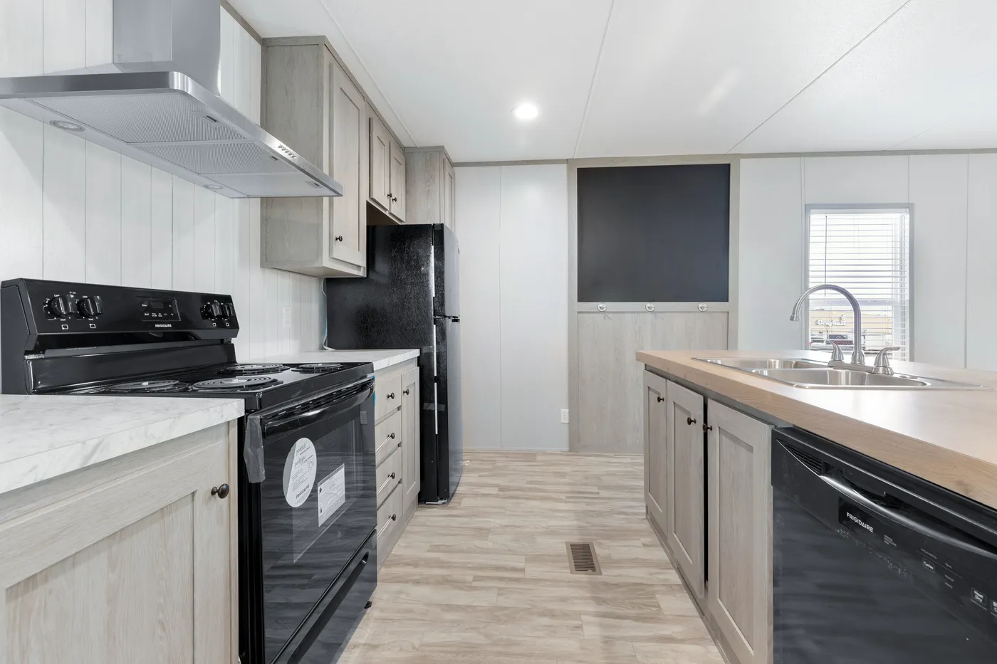 The BREEZE 16602A Kitchen. This Manufactured Mobile Home features 2 bedrooms and 2 baths.