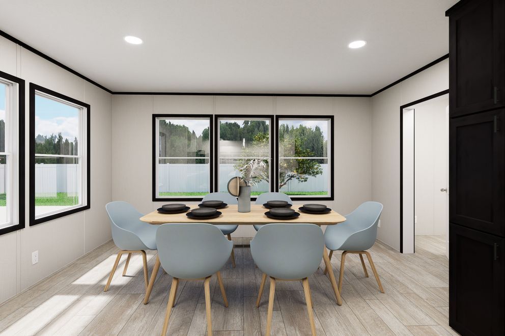 The ULTRA FLEX JEWEL GRANDE Dining Area. This Manufactured Mobile Home features 4 bedrooms and 2 baths.