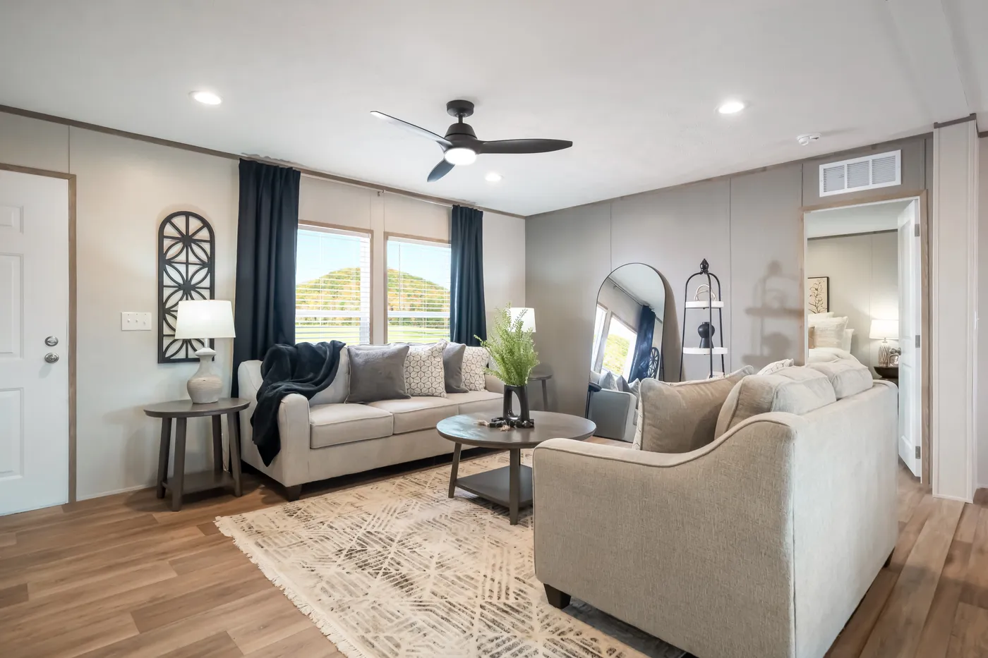 The ECLIPSE Living Room. This Manufactured Mobile Home features 4 bedrooms and 2 baths.
