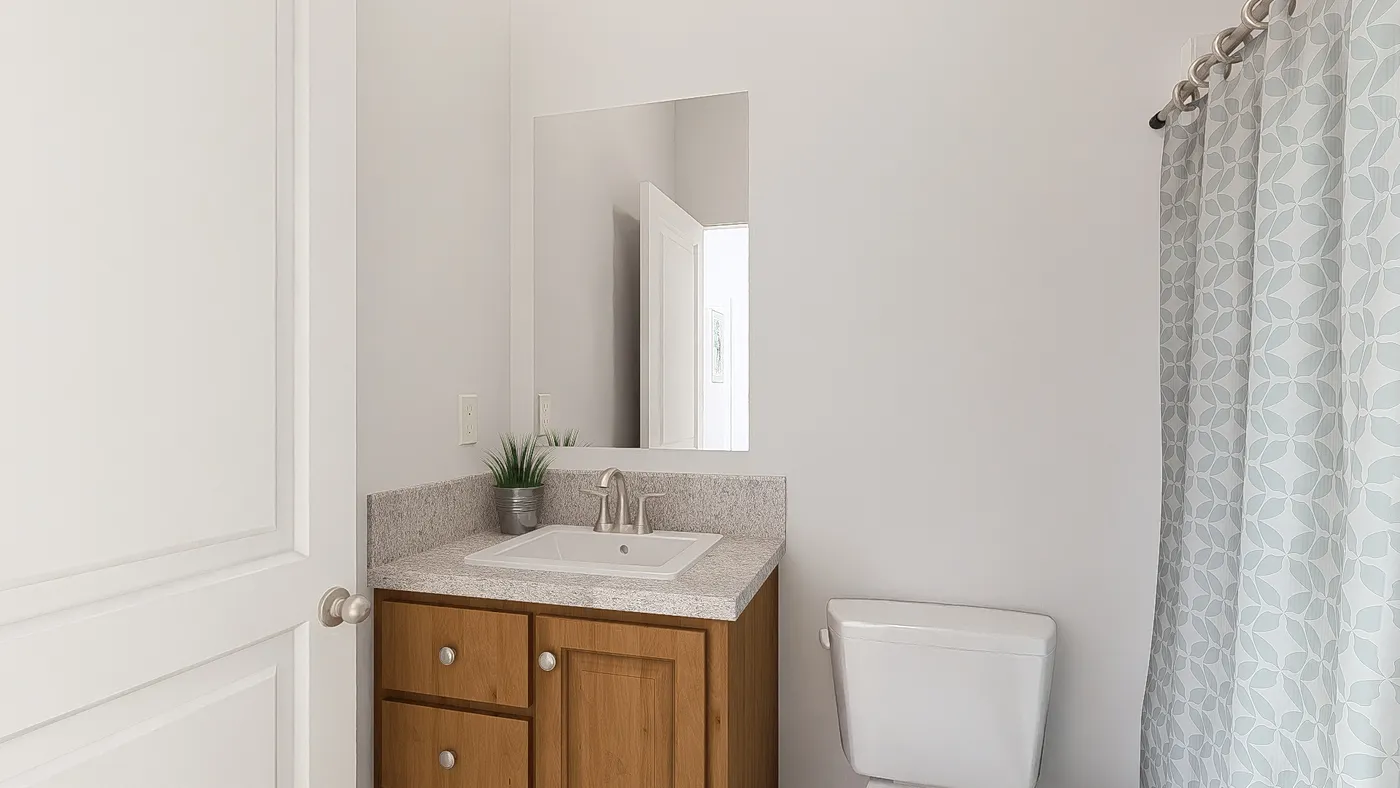 The DRM601M 60'              DREAM Primary Bathroom. This Manufactured Mobile Home features 1 bedroom and 2 baths.