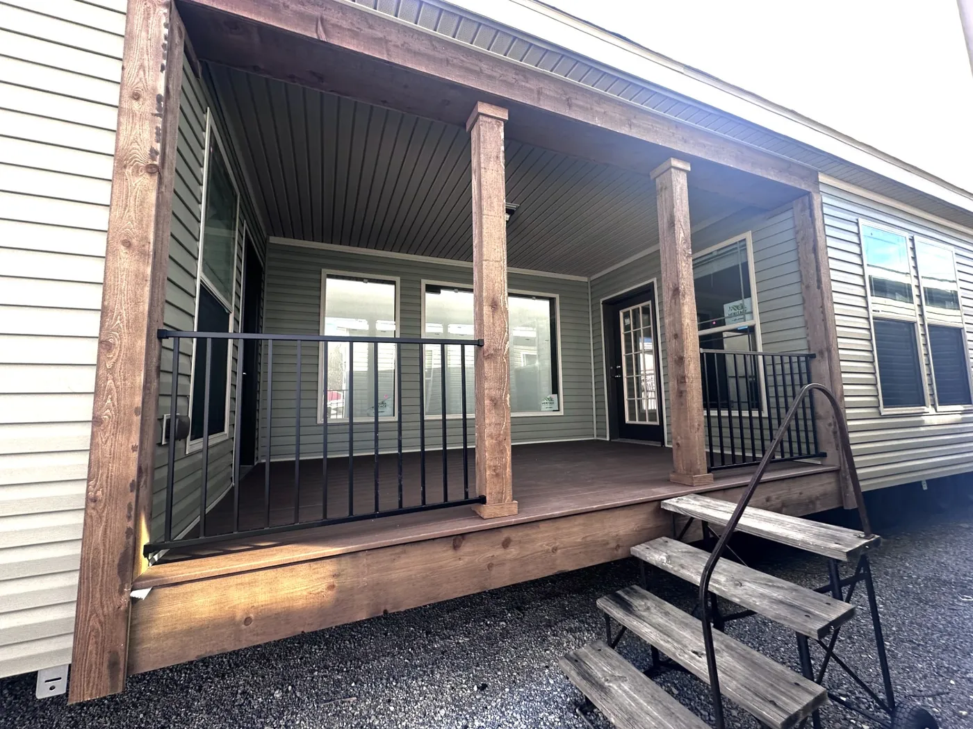 Back porch with access to Kitchen and Primary Bedroom.