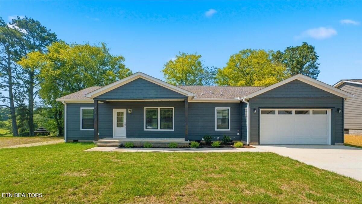 The covered front porch is the perfect place to sit in the shade, wave to neighbors, and enjoy East Tennessee hospitality.