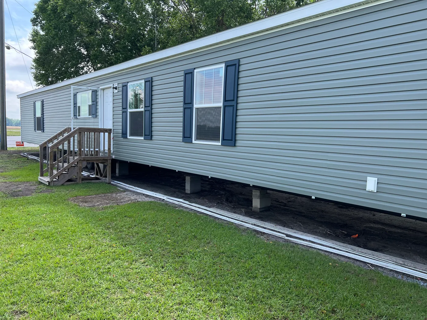 Sagebrook siding with Indigo Blue shutters and weather wood shingles.