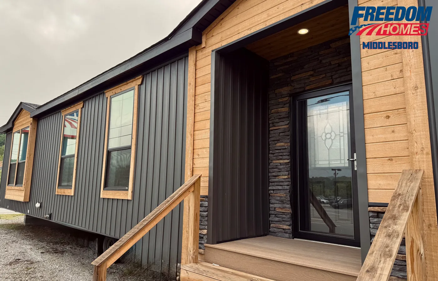 Exterior w/ batten vinyl siding. Cedar accents, stone accents.