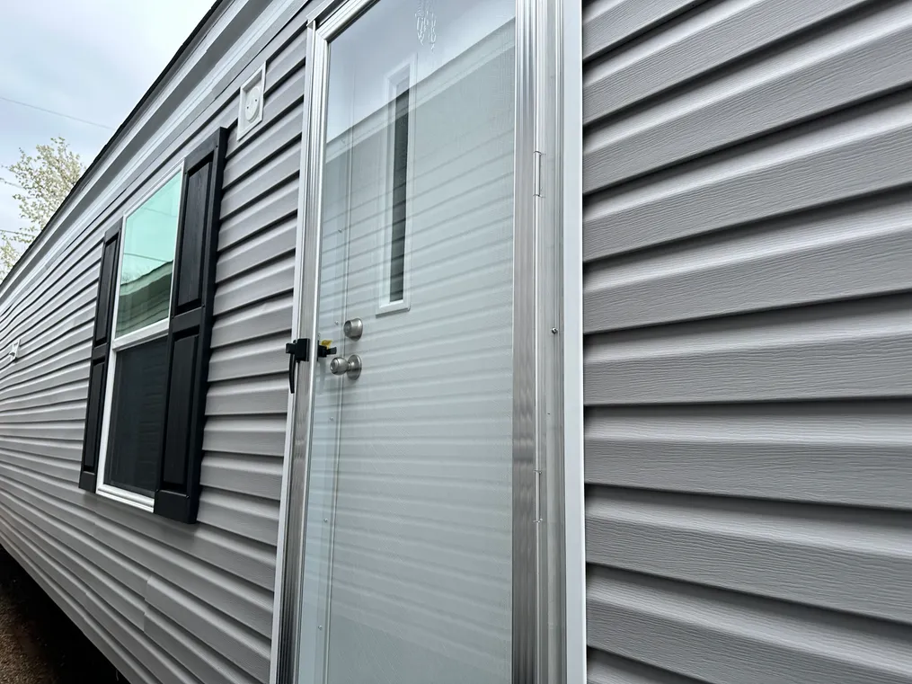 Flint gray siding with black shutters.  