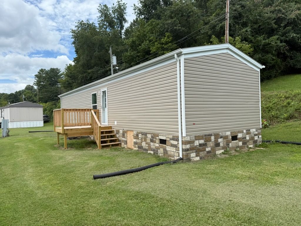 Large decks, Stone Foundation, Gutters, Electric already hooked! Move in Ready!
