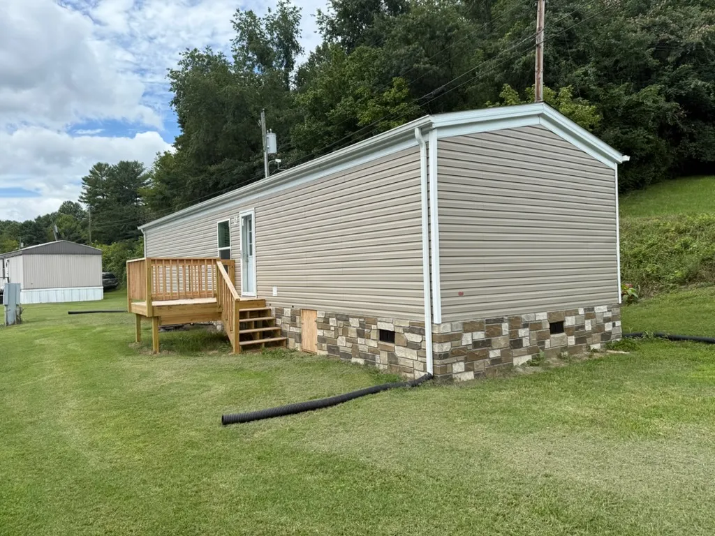 Large decks, Stone Foundation, Gutters, Electric already hooked! Move in Ready!