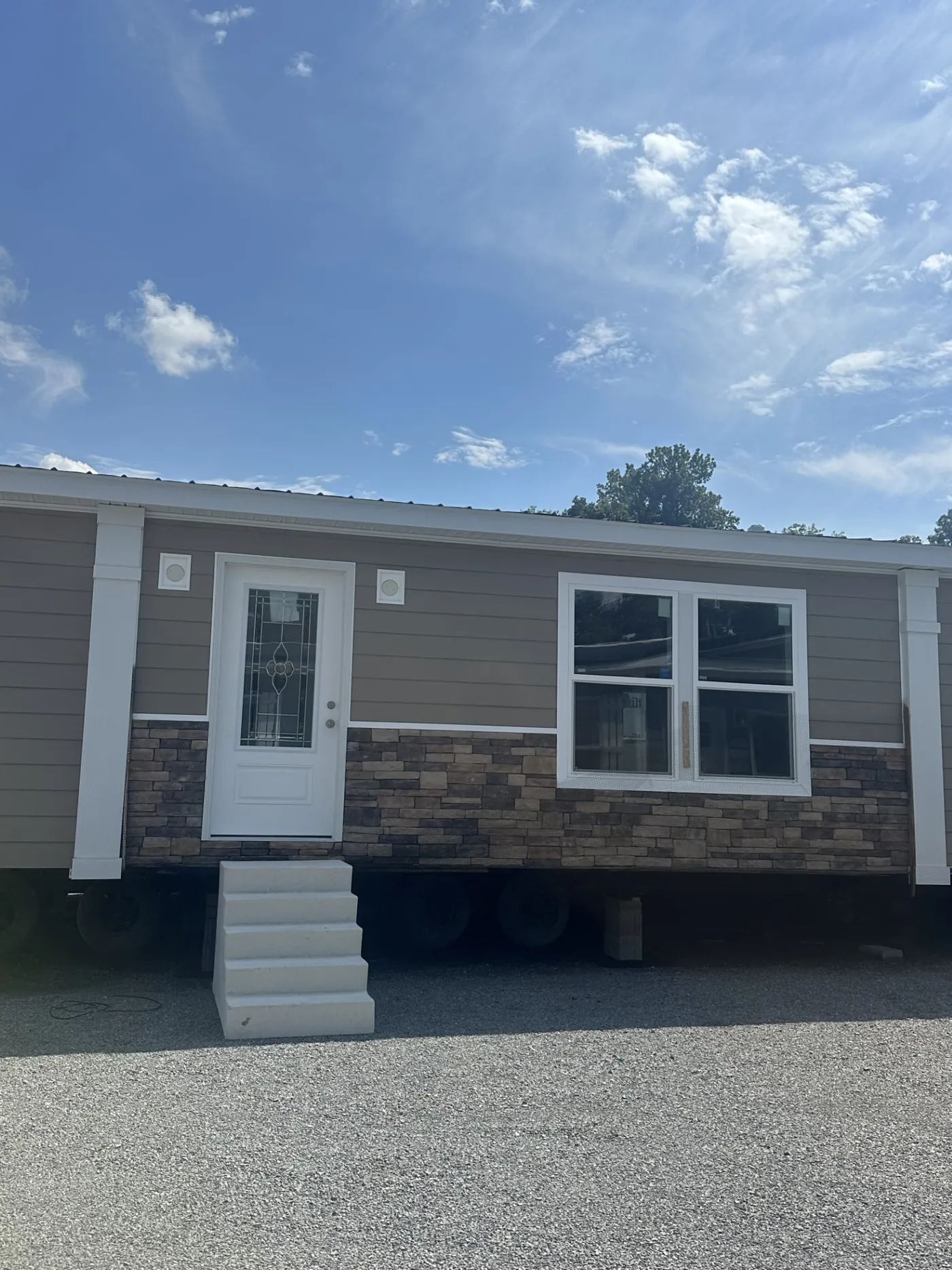 Stone Accented exterior and Metal Roof