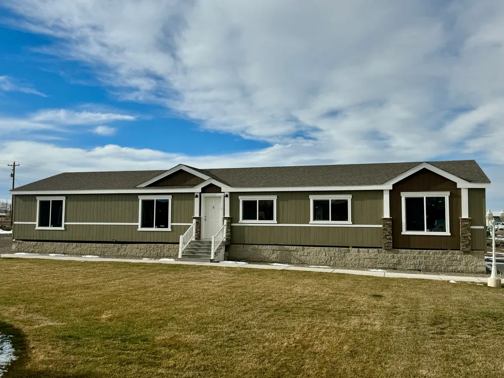 Beautiful exterior with dual dormers and rock columns.