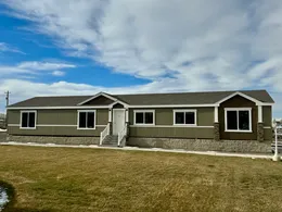 Beautiful exterior with dual dormers and rock columns.