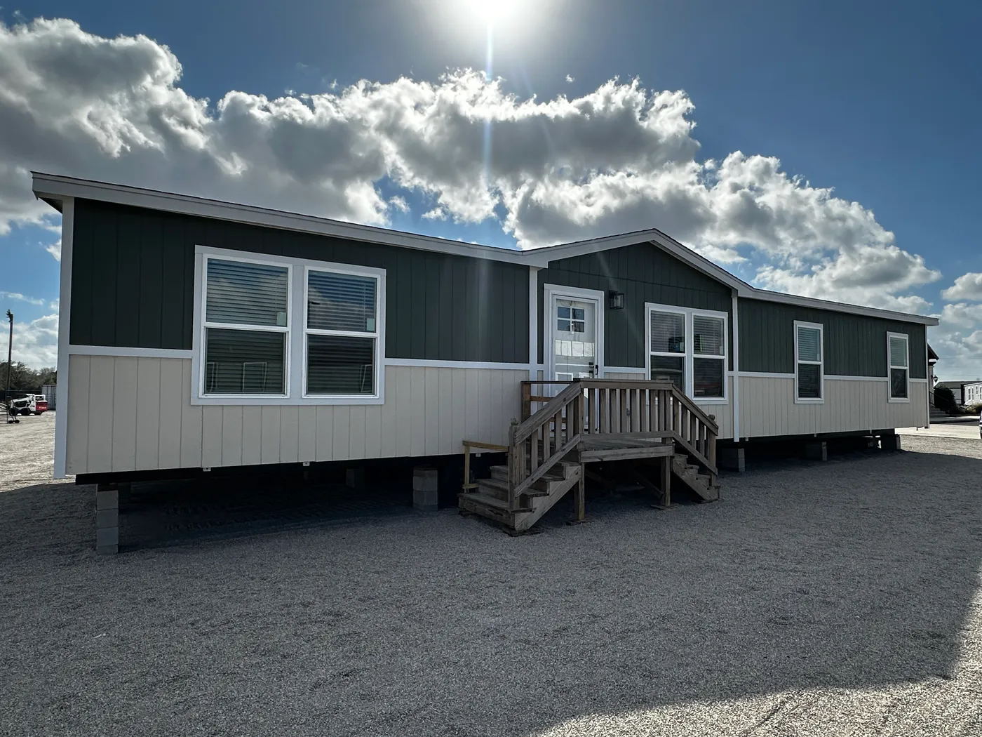 Spacious 3 bedroom, 2 bathroom double wide manufactured home built for comfort and family living. This open layout features both a living room and separate den, perfect for movie nights, entertaining, or creating private space for kids and adults. The modern kitchen includes stainless steel appliances and ample cabinet space. Enjoy year-round comfort with energy-efficient upflow ceiling vents for improved airflow. The private primary suite offers a relaxing retreat with a large soaking tub and s