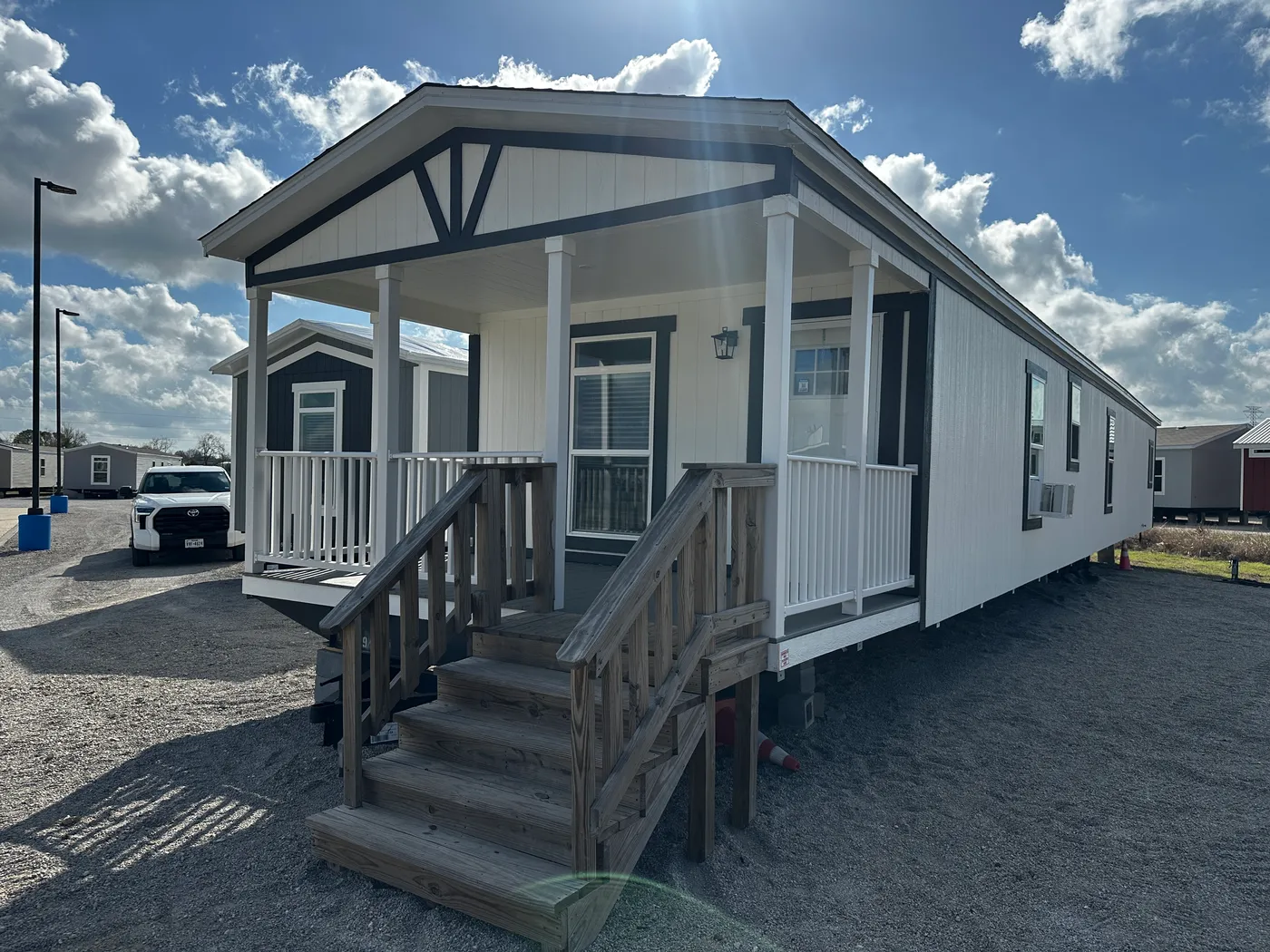 Discover the most affordable and spacious 4 bedroom, 2 bath doublewide manufactured home on the market! This budget-friendly mobile home features elevated ceilings, an open-concept layout, and plenty of room to grow with both a living room and separate den—perfect for entertaining, relaxing, or family space. The modern kitchen includes a large center island with ample storage and workspace. The private primary suite offers a walk-in closet, plus a luxury separate soaking tub and walk-in shower f