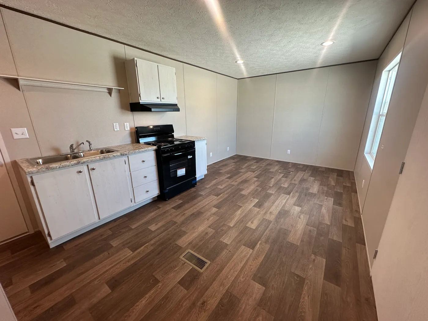 Looking for an affordable tiny mobile home, hunting lodge, vacation getaway, guest house, or mother-in-law suite? This 432 sq. ft. one bedroom, one bath tiny home is the perfect compact living solution. Designed for simple, efficient living, this small manufactured home offers everything you need in a smart, budget-friendly floor plan. Whether you need a weekend cabin for hunting land, a private vacation home, extra space for family, or an affordable full-time home, this tiny mobile home deliver