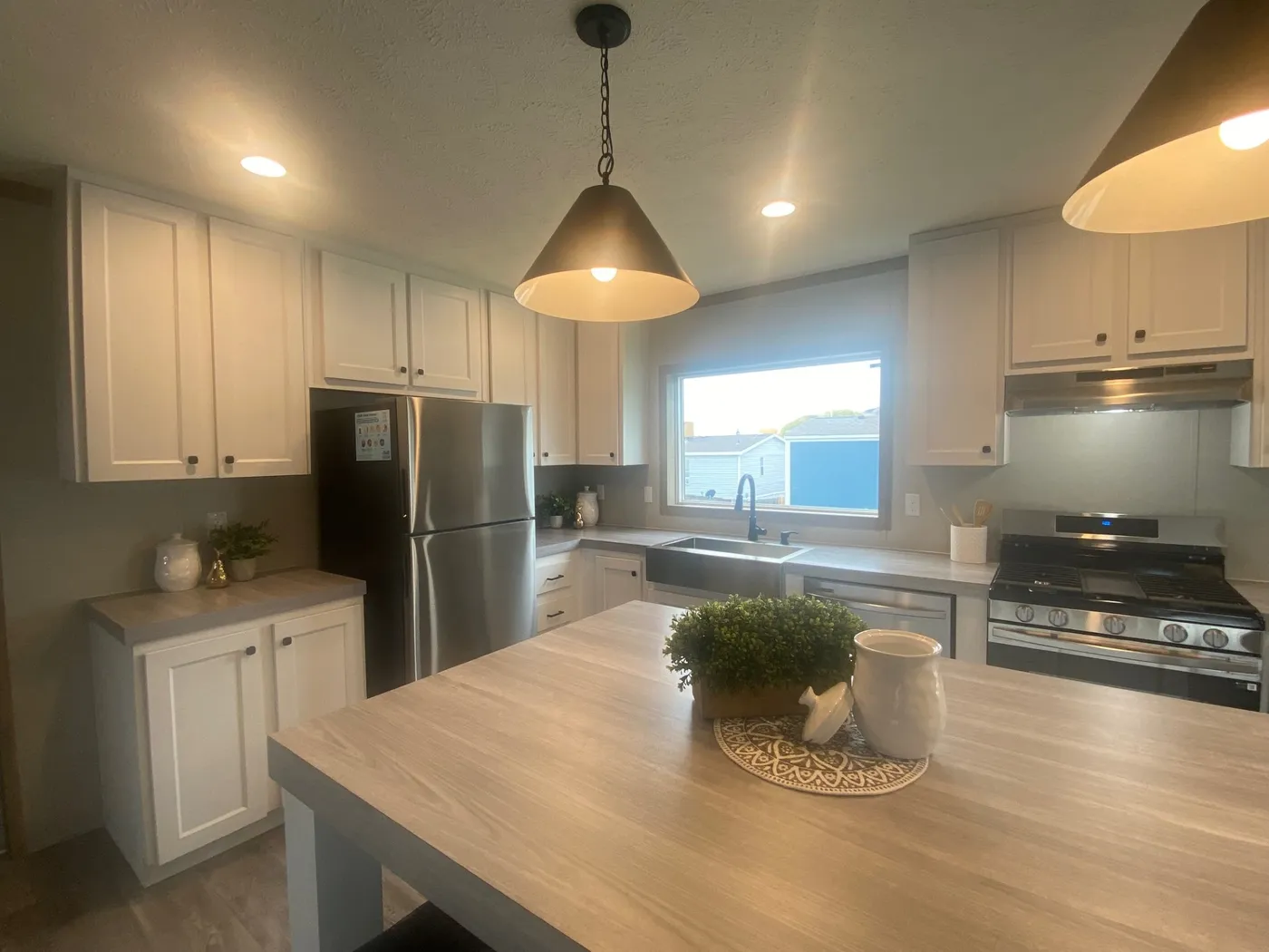 Awesome kitchen with stainless steel appliances and large window