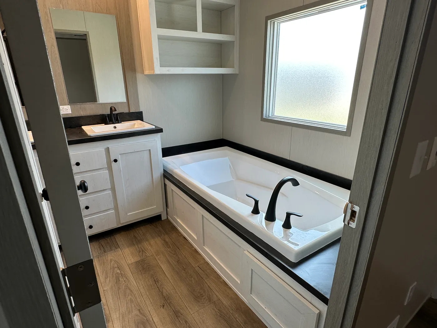 Introducing The Harvest, a beautiful 3 bedroom, 2 bathroom manufactured home with 1,216 sq. ft. of comfortable living space. This home is packed with popular upgrades, including a stainless steel farmhouse sink, a spacious kitchen design, built-in entertainment system, and upflow vents for added comfort and better furniture placement.

The private primary suite features a large garden soaking tub and separate walk-in shower, giving you the perfect place to relax after a long day. On the outsid