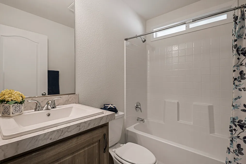 Guest bath with one-piece soaking tub/shower combo