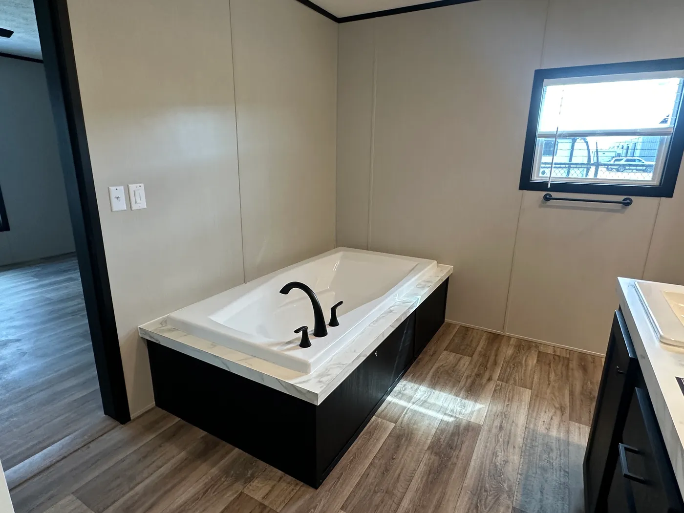 Discover The Heritage, a beautiful 3-bedroom, 2-bath manufactured home offering 1,568 square feet of spacious, functional living at Clayton Homes of Alvin, Texas! This stunning home features a spacious open-concept living room, a modern kitchen with an oversized multifunctional island, and a beautiful built-in fireplace. Enjoy a thoughtfully designed private split-bedroom floor plan, offering comfort and separation for the entire family. The oversized utility and laundry room features a convenie