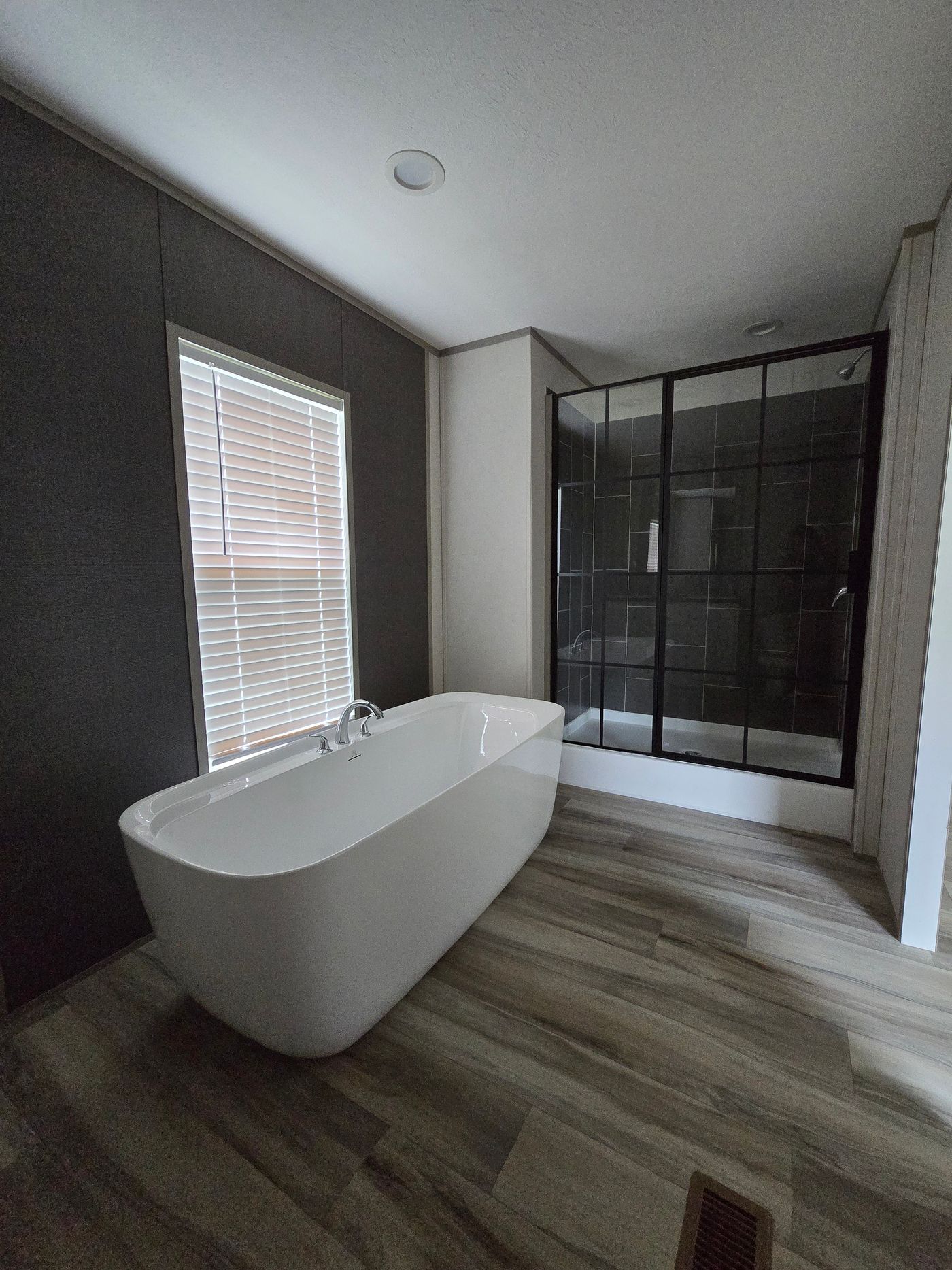 Soaker tub and oversized walk in tile shower