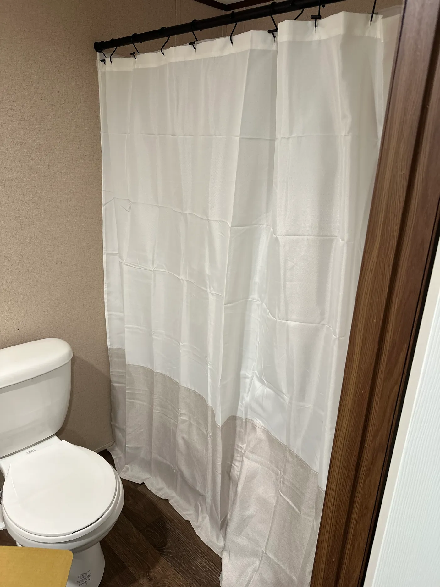 Designer shower curtain in primary bath.  