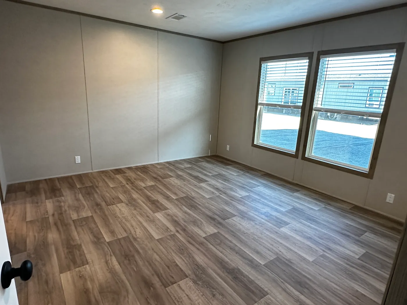 Modern luxury meets affordability in this 3 bedroom, 2 bathroom double wide manufactured home designed for comfort and style. The open-concept layout features a spacious living area with a gorgeous built-in entertainment center and plenty of natural light. The designer kitchen includes stainless steel appliances, a large kitchen island, and ample cabinet space, perfect for cooking and entertaining. Enjoy enhanced comfort with energy-efficient upflow ceiling vents for improved airflow throughout 