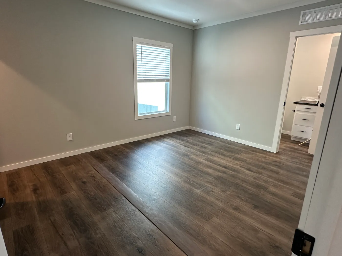 Step inside one of the most beautiful 4 bedroom, 3 bathroom tape and textured doublewide manufactured homes on the market. This stunning home is designed with upscale finishes, open living space, and modern comfort throughout. The spacious living room features vaulted ceilings, elegant crown moulding, and a built-in fireplace that creates a warm, high-end feel the moment you walk in.

The kitchen is loaded with premium features, including quartz countertops, stainless steel appliances, and a s
