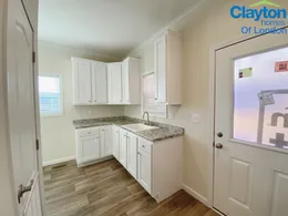 Spacious Utility Room. Equipped w/ utility sink, cabinets, exterior door. Room for a freezer.