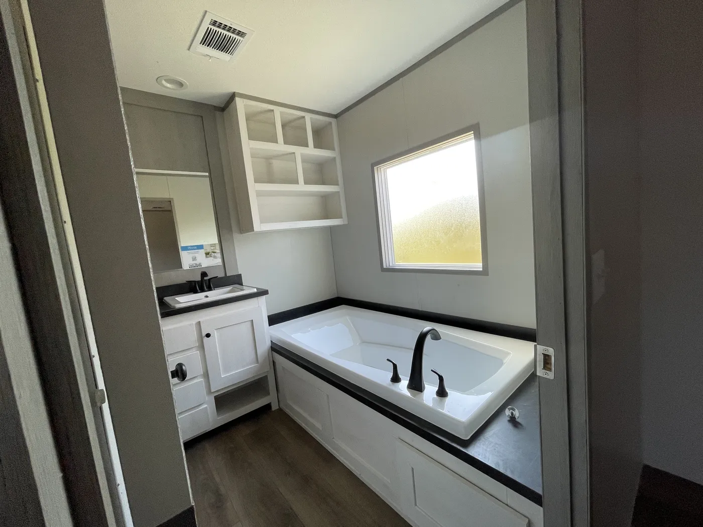 Primary Bath w/ Garden Tub and Shelving