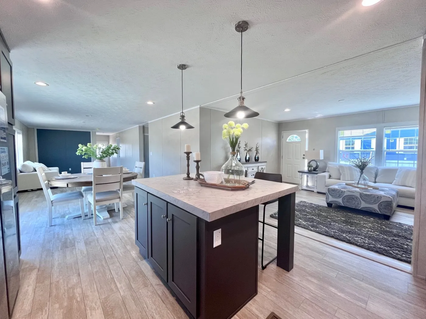 Separate gathering areas that meet in the middle.  Open Floor Plan 