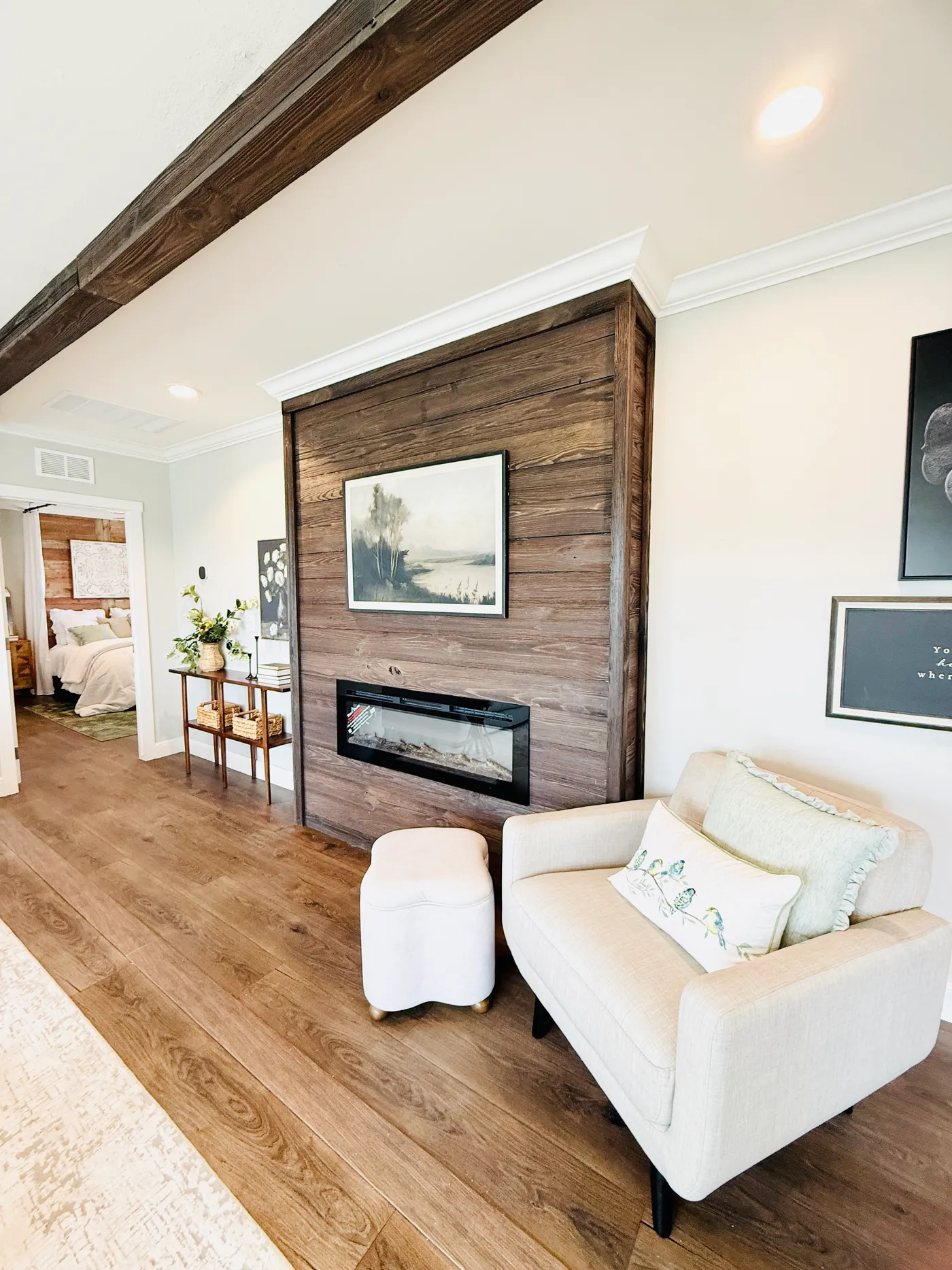 A cozy feature that steals the show.
This beautiful built-in electric fireplace with a wood accent wall creates a stunning focal point in the home. It’s the perfect spot to relax with a book, enjoy a quiet evening, or add a warm, inviting feel when entertaining guests.
