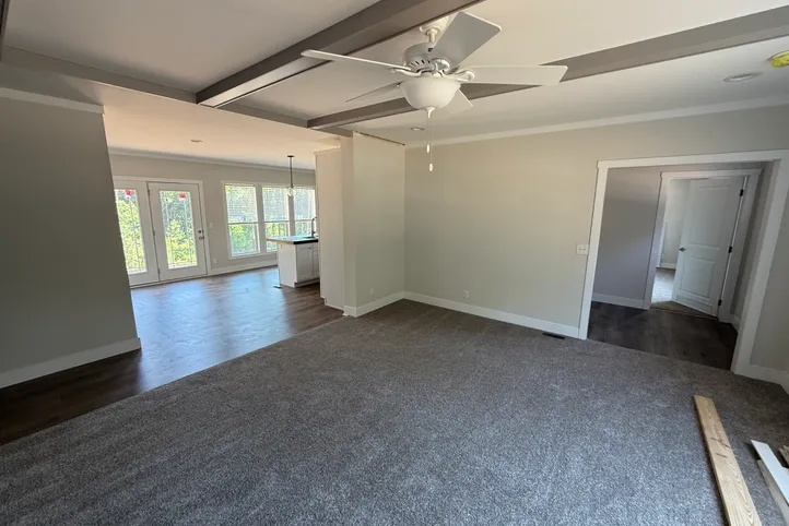 Living room into kitchen with lots of natural light!