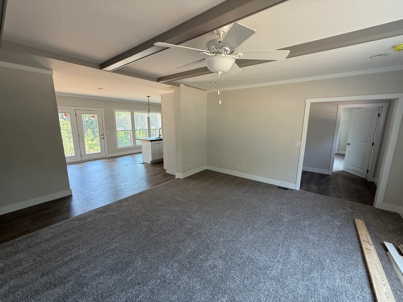 Living room into kitchen with lots of natural light!