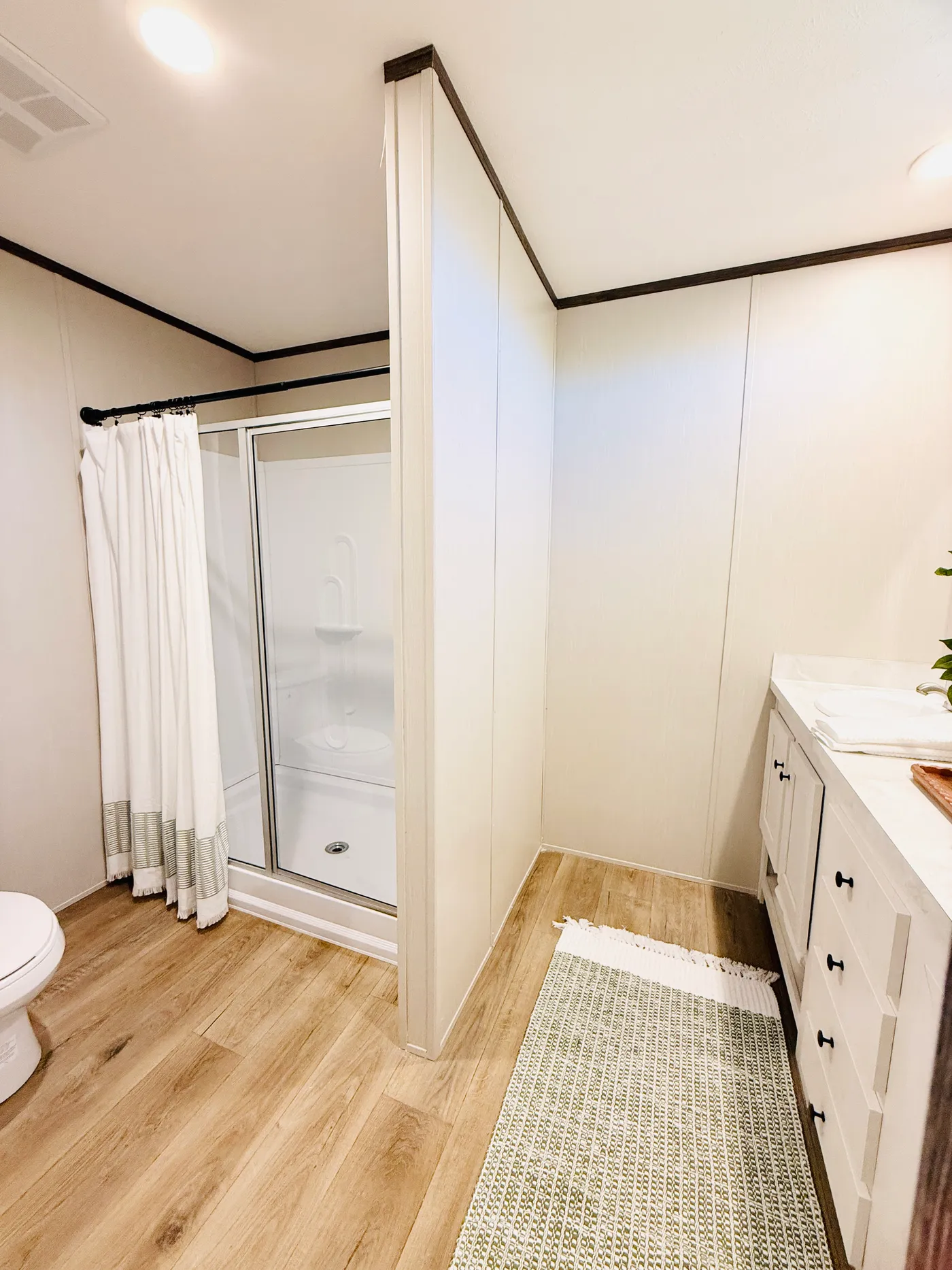 Clean, modern, and easy to maintain.

This bright bathroom features a spacious vanity and a walk-in shower, giving you a comfortable and functional space for your daily routine.