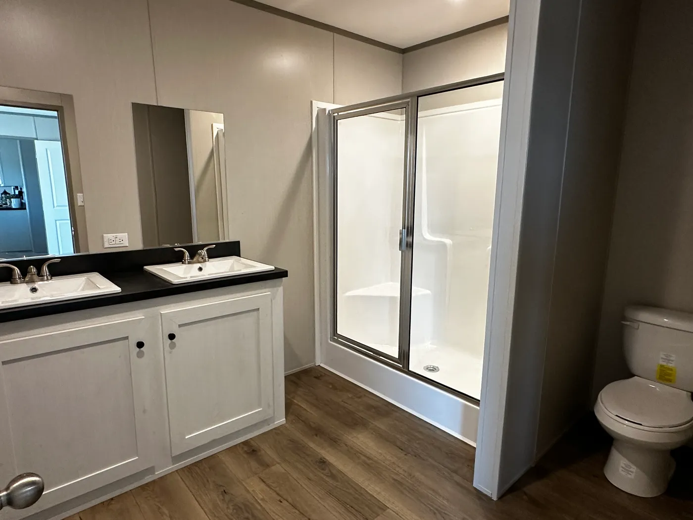 Affordable luxury meets modern comfort in this 3 bedroom, 2 bathroom manufactured home designed for spacious living and energy efficiency. The open-concept layout features a stylish kitchen with stainless steel appliances and a large walk-in pantry for extra storage. The private primary suite includes a generous walk-in closet and a relaxing retreat feel. Enjoy improved comfort with ceiling air vents for better airflow and temperature control throughout the home. This energy-efficient home offer