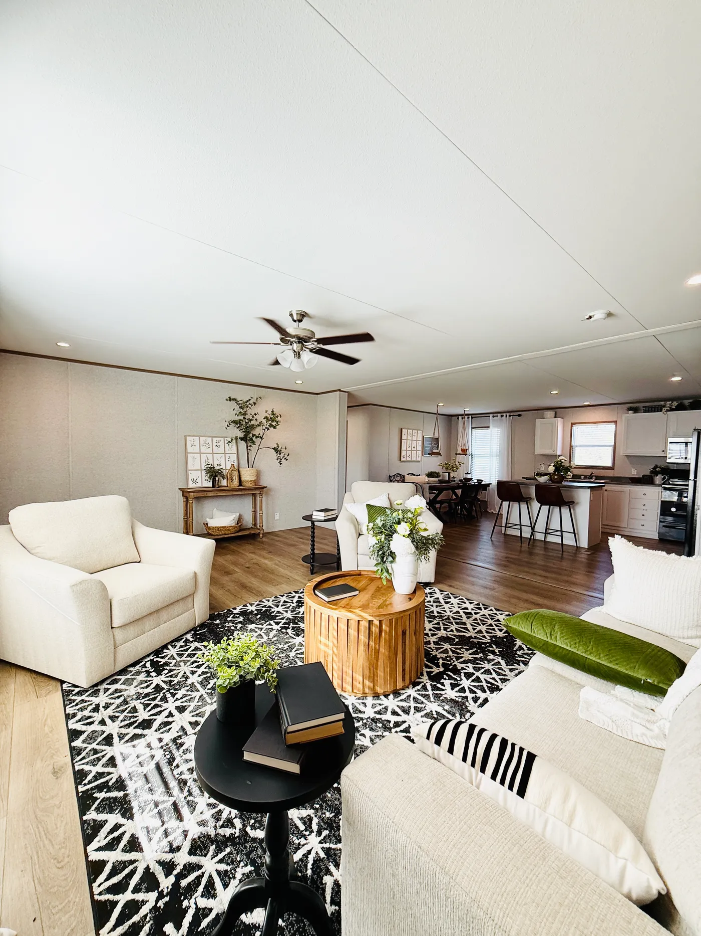 This bright open-concept living space flows perfectly into the kitchen and dining area, making it ideal for relaxing with family or entertaining guests.

The large layout, natural light, and modern finishes create a space that feels warm, inviting, and perfect for everyday living.

Whether you're hosting friends, watching movies, or enjoying a quiet evening at home, this living room gives you plenty of space to unwind.