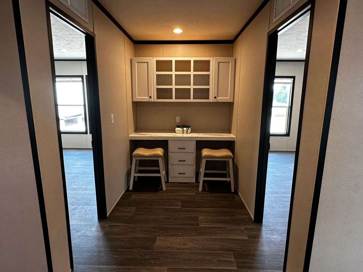 Spacious 4 bedroom 2 bath double wide manufactured home with massive square footage and modern design. Features an open floor plan with a large living room and separate den, perfect for entertaining or family living. The master suite offers a relaxing garden soaking tub, tiled-in walk-in shower, and plenty of space. Enjoy a cozy built-in fireplace, stylish finishes, and energy-efficient construction. This affordable mobile home is ideal for families seeking space, comfort, and value.
